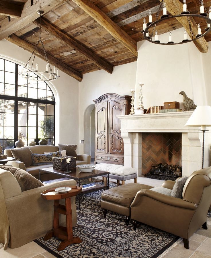 Large mediterranean enclosed living room in Phoenix with white walls, a standard fireplace and no tv.