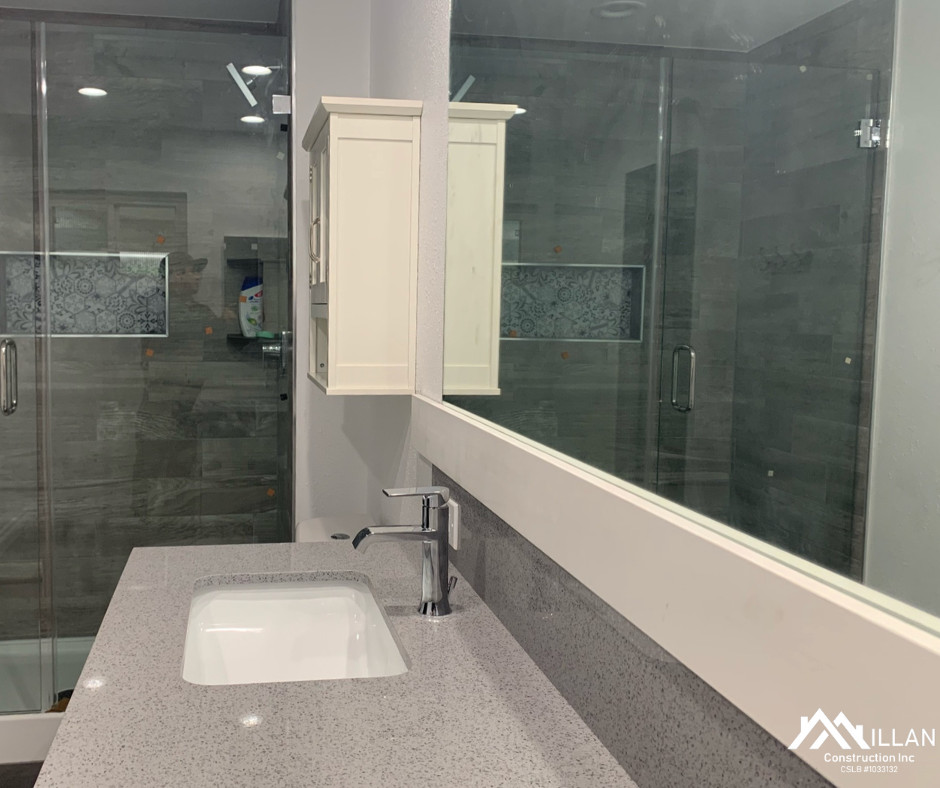 Bathroom vanity with trim piece and mirror