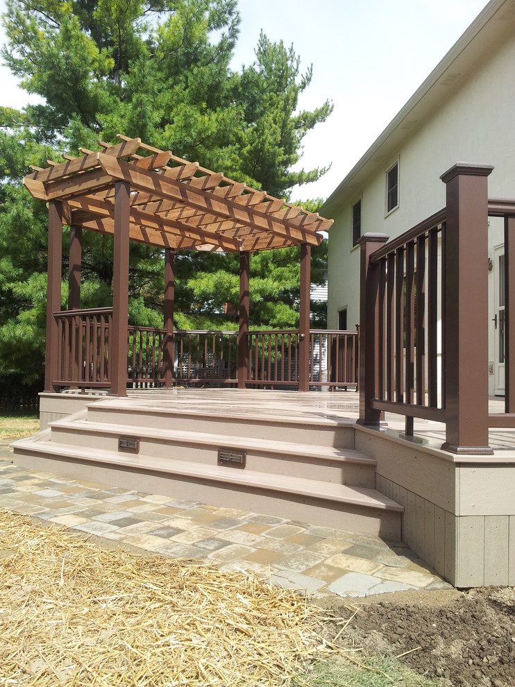 Mid-sized transitional backyard deck photo in Columbus with a pergola