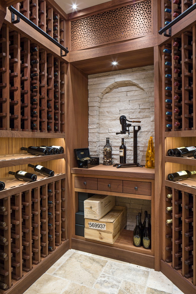 Photo of a large transitional wine cellar in Omaha with ceramic floors and storage racks.