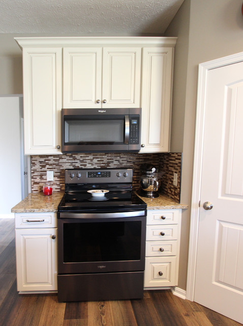 Cream Kitchen With Contrasting Dark Island With Quartz Countertop