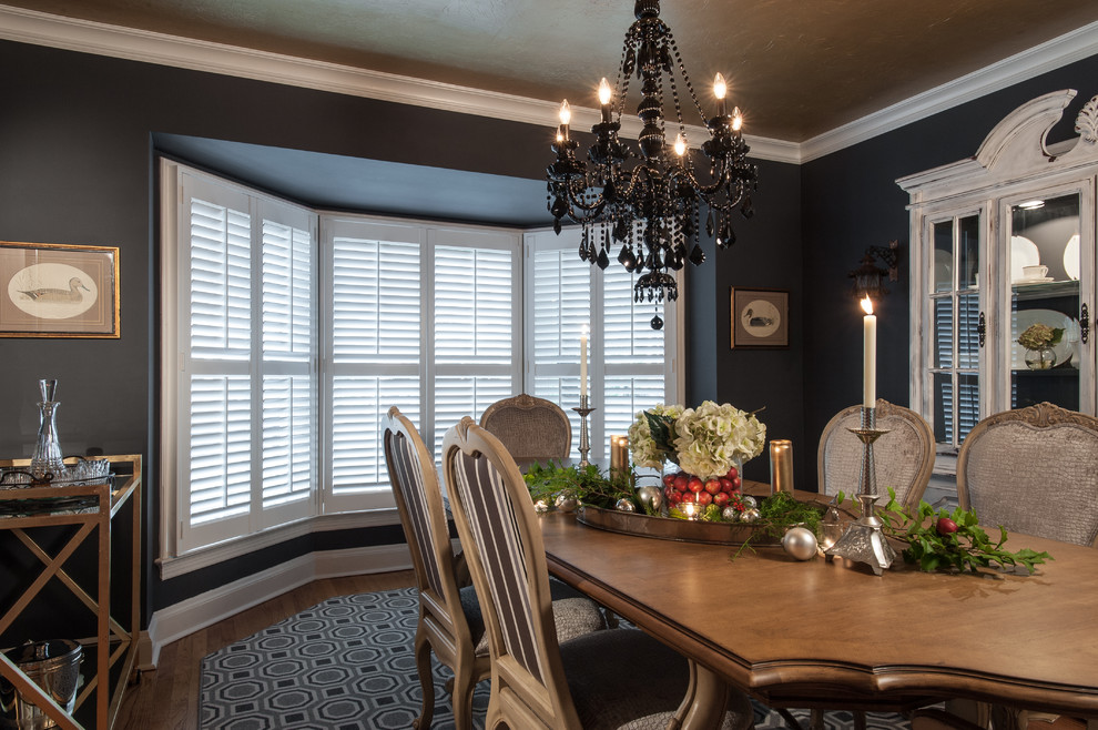 Enclosed dining room - mid-sized traditional medium tone wood floor and brown floor enclosed dining room idea in St Louis with gray walls