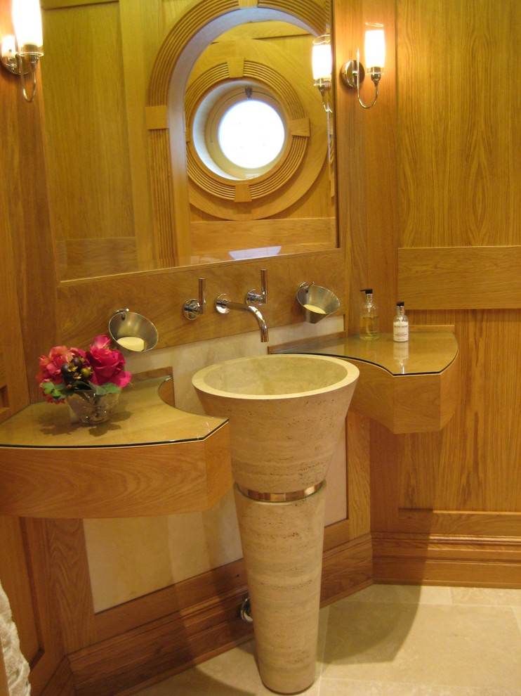 Transitional powder room in Cheshire with a pedestal sink and glass benchtops.