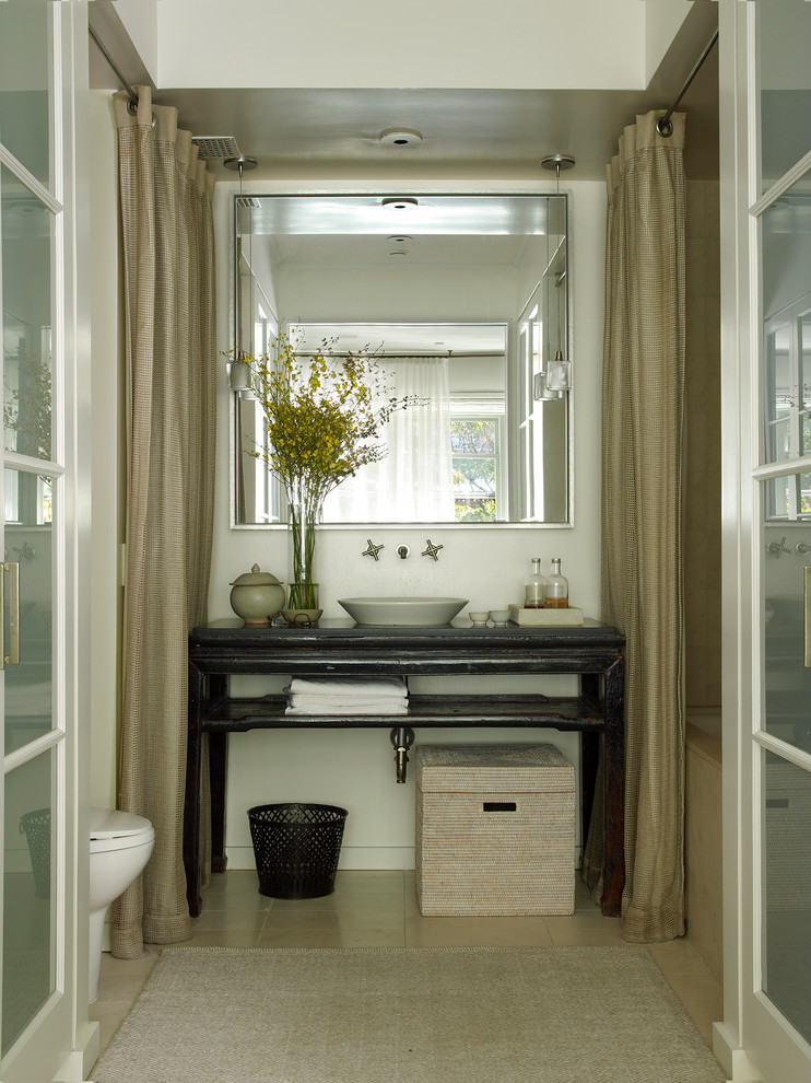 This is an example of a powder room in Nashville with a vessel sink.
