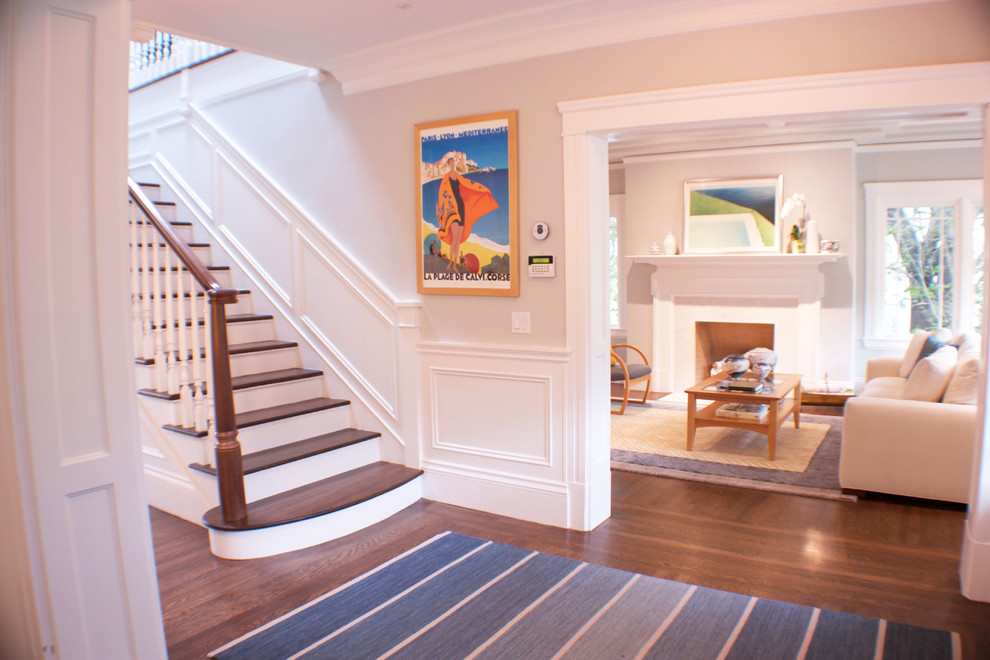 Photo of a mid-sized transitional foyer in San Francisco with grey walls, medium hardwood floors and a single front door.