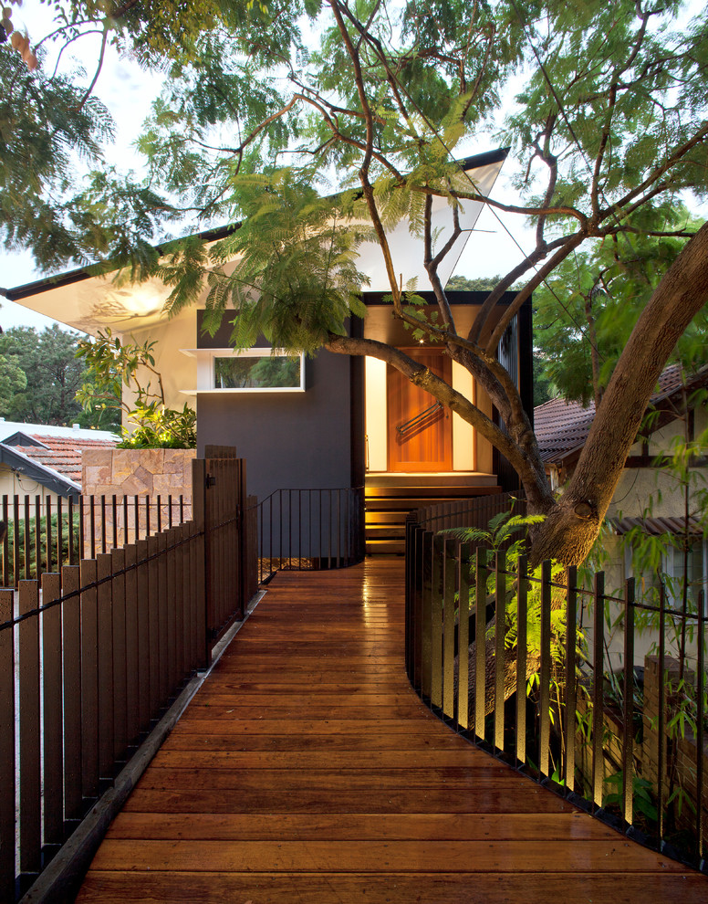 This is an example of a contemporary black exterior in Sydney with a shed roof.