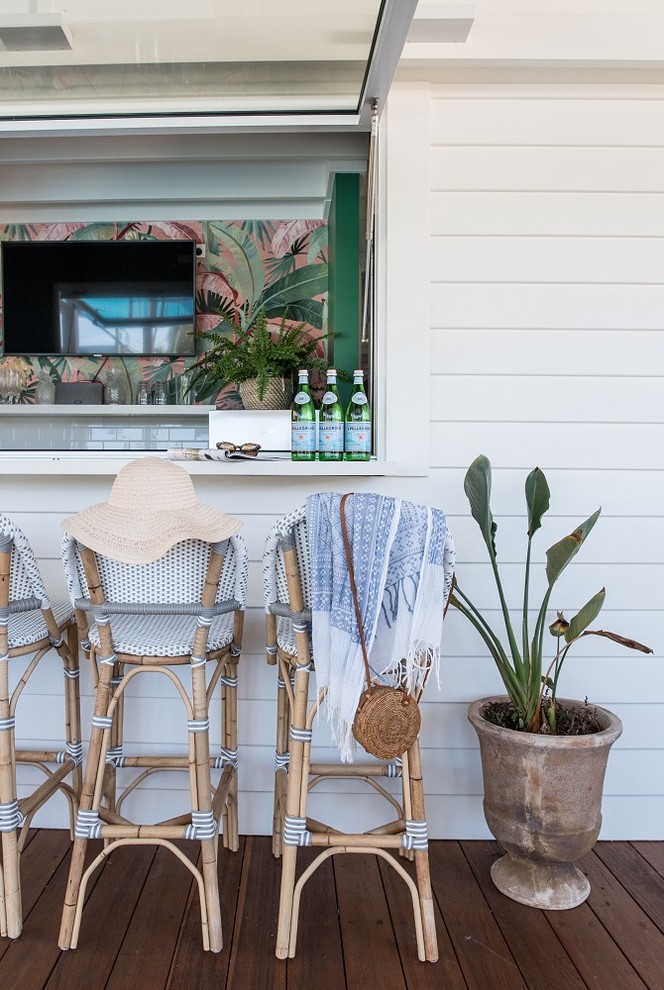 Inspiration for a small beach style galley seated home bar in Sunshine Coast with a drop-in sink, shaker cabinets, white cabinets, quartz benchtops, white splashback, subway tile splashback, marble floors and white benchtop.