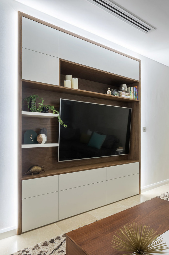 This is an example of a large contemporary living room in Perth with limestone floors and a built-in media wall.