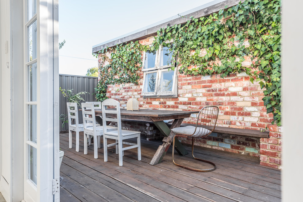 Photo of a shabby-chic style rooftop and rooftop deck in Perth with no cover.