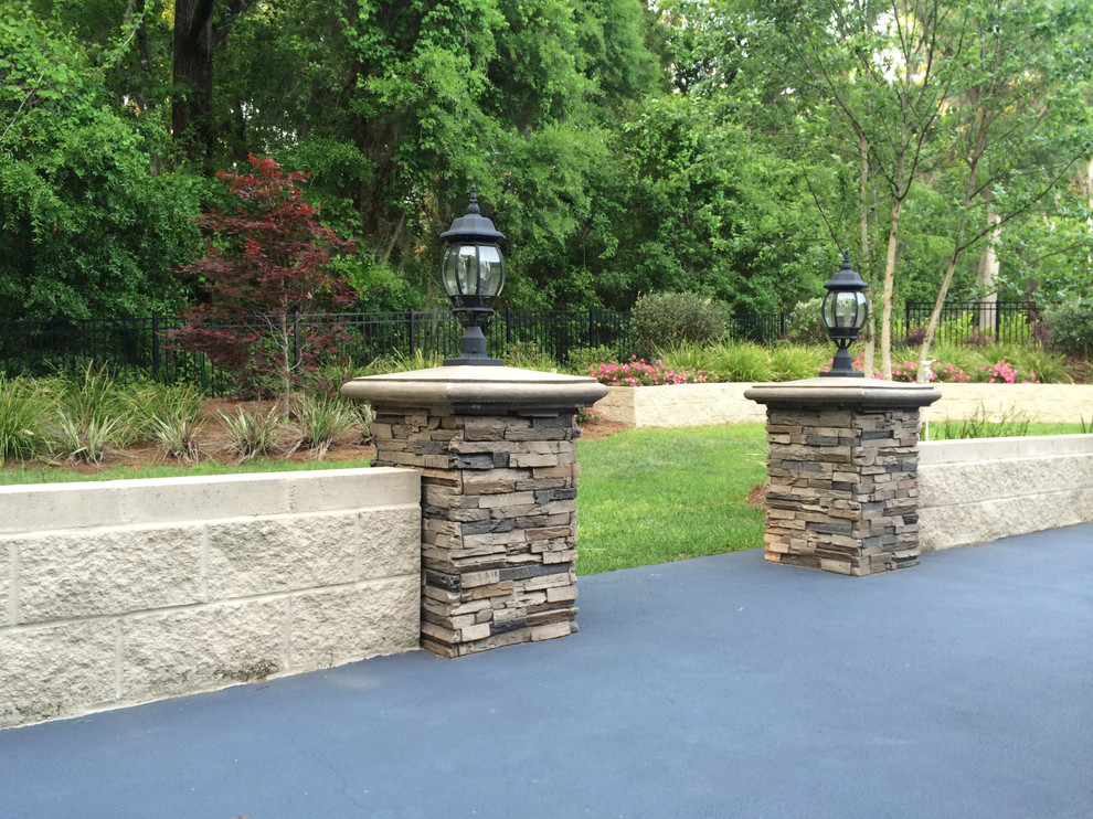 Large traditional backyard patio in Charlotte with concrete slab and no cover.