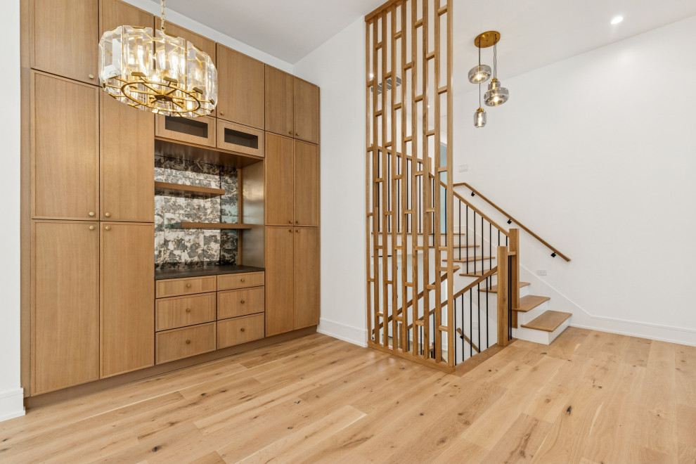 Curated Entryway with Full-Height Cabinetry & Architectural Stair Detail