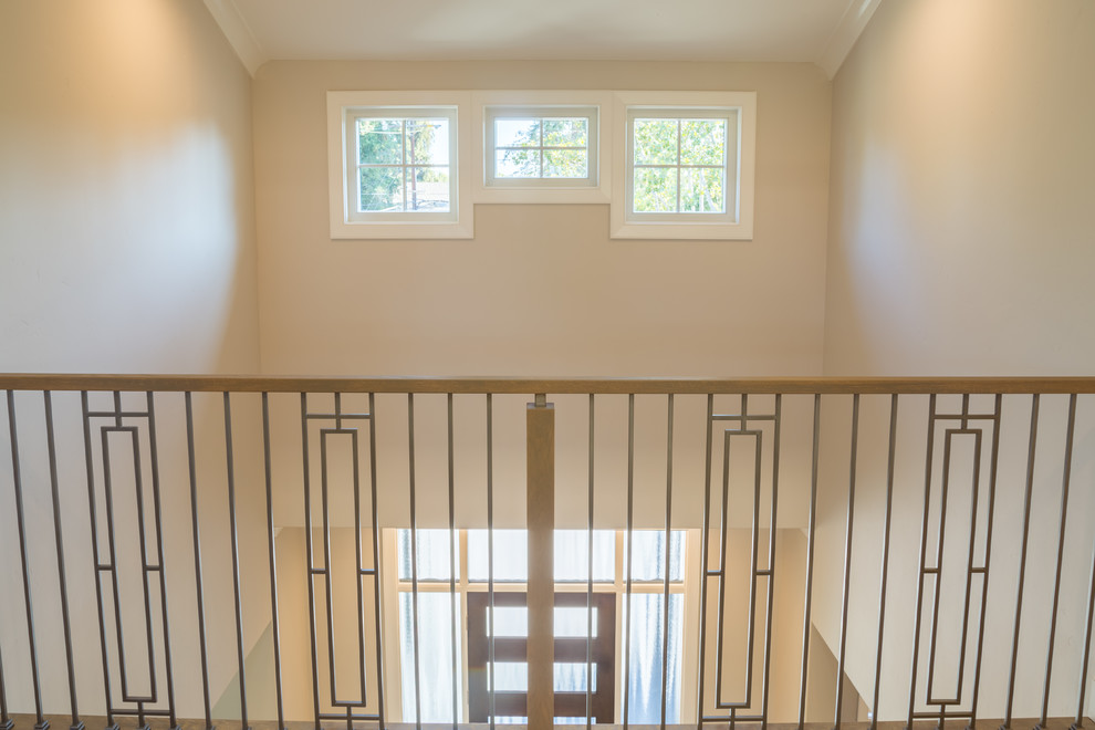 Example of a mid-sized transitional dark wood floor and brown floor front door design in San Francisco with beige walls and a glass front door