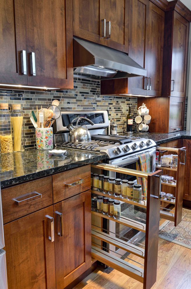 Open concept kitchen - small craftsman galley medium tone wood floor open concept kitchen idea in Orange County with a double-bowl sink, beaded inset cabinets, concrete countertops, beige backsplash, stainless steel appliances, an island, matchstick tile backsplash and dark wood cabinets