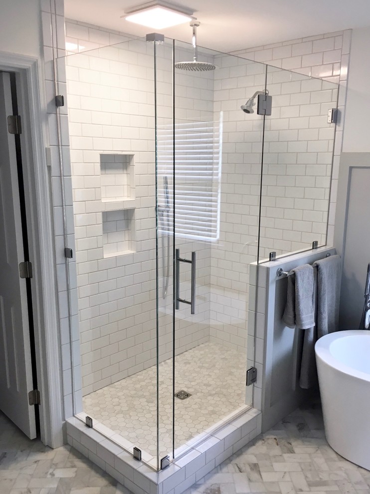 Mid-sized transitional master bathroom in Other with a freestanding tub, an alcove shower, white tile, subway tile, white walls and a hinged shower door.