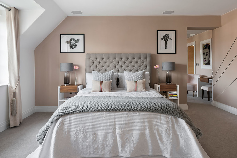 Inspiration for a mid-sized transitional guest bedroom in Berkshire with pink walls, carpet and grey floor.