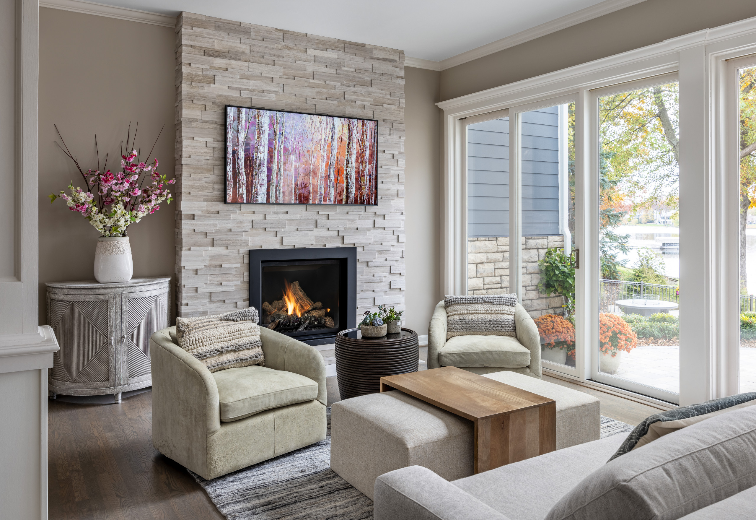 This cozy living room renovation, completed in the summer of 2021, was the perfect update for a busy family of six. Located on Long Lake, just north of Metro Detroit, this space sits just off the pool