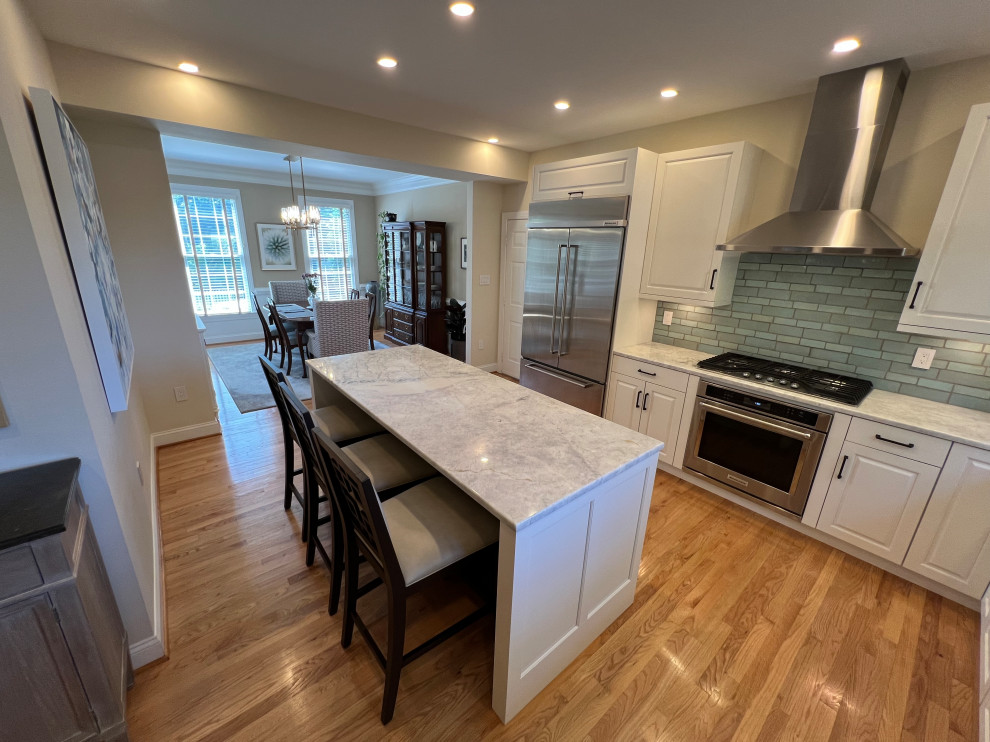 A 42" Subzero and beautiful blue backsplash tile complete the look.