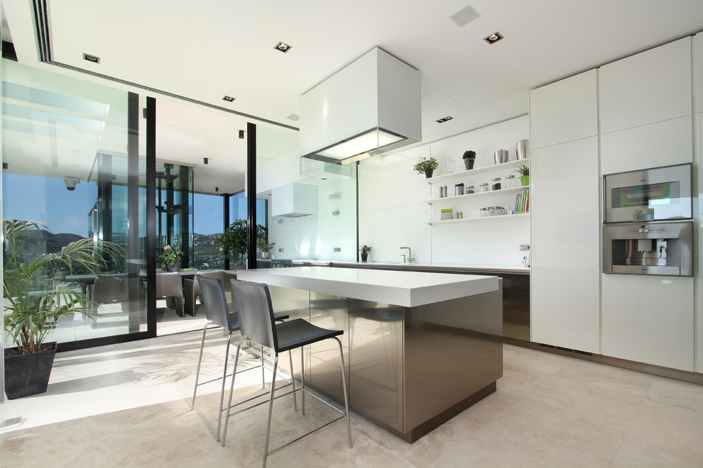 Inspiration for a contemporary kitchen in Manchester with white cabinets.