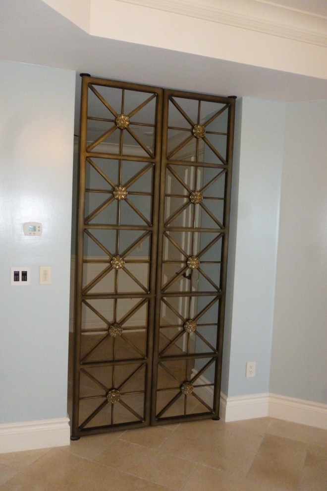 Design ideas for a small contemporary entryway in Miami with blue walls, ceramic floors and a pivot front door.
