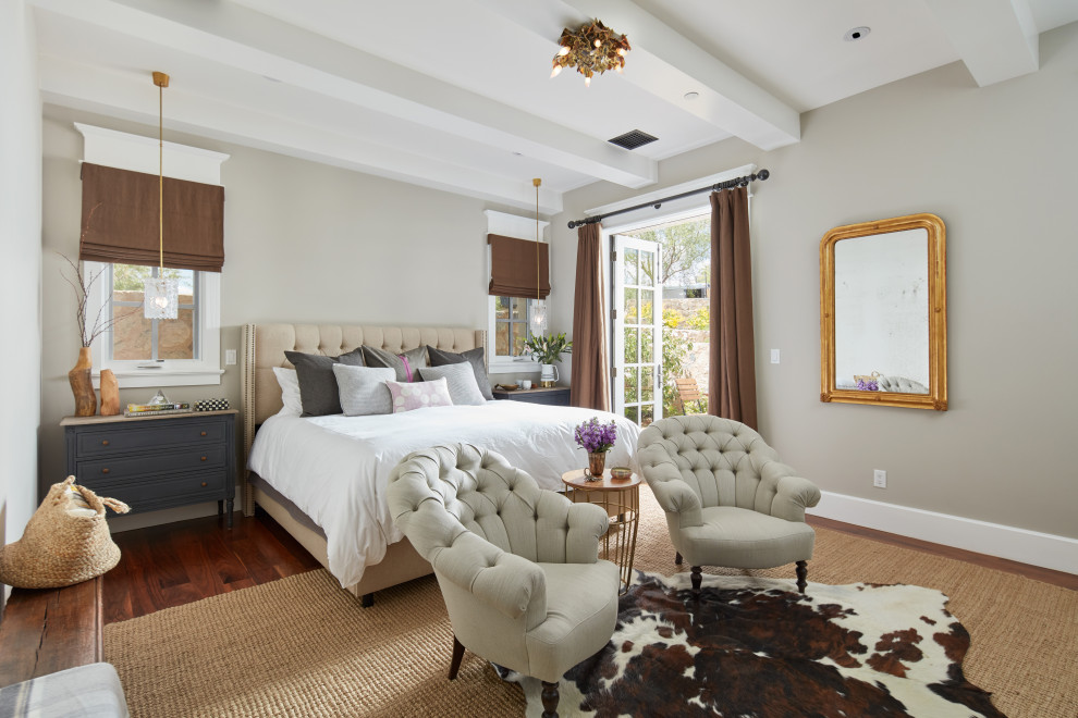 This is an example of a country bedroom in Phoenix with grey walls, dark hardwood floors and brown floor.