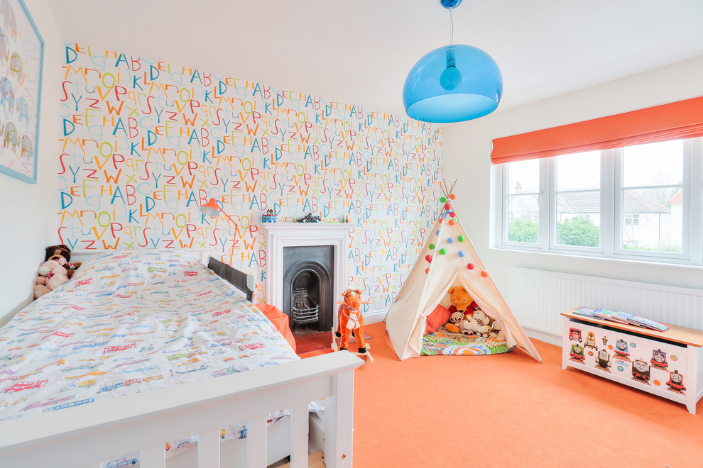 Transitional gender-neutral kids' bedroom in Hertfordshire with multi-coloured walls and carpet for kids 4-10 years old.