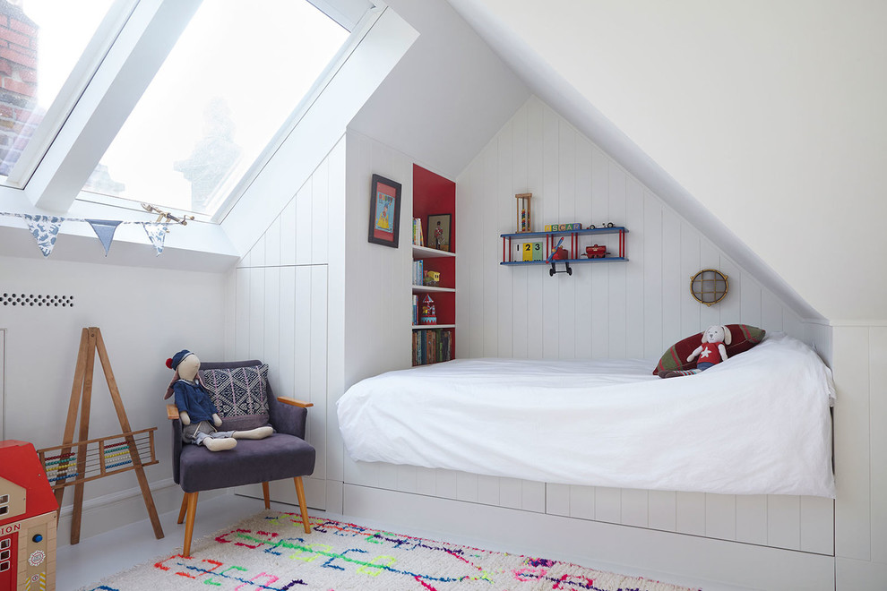 Design ideas for a mid-sized contemporary kids' bedroom for kids 4-10 years old and boys in London with white walls, light hardwood floors and beige floor.