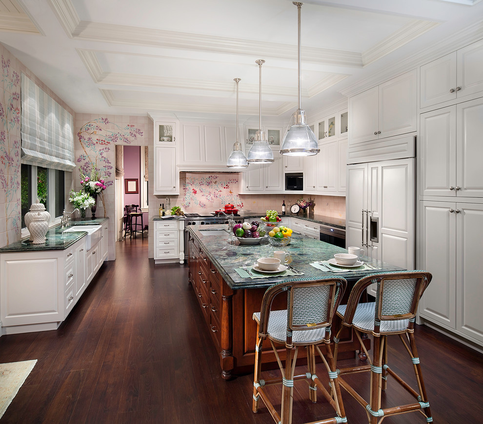 Traditional u-shaped separate kitchen in Miami with raised-panel cabinets, white cabinets and panelled appliances.