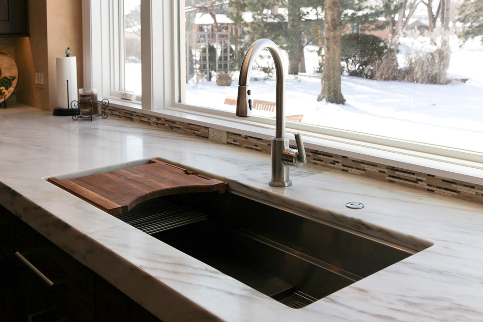 Transitional medium tone wood floor kitchen photo in Chicago with an undermount sink, shaker cabinets, dark wood cabinets, wood countertops, multicolored backsplash, ceramic backsplash and stainless steel appliances