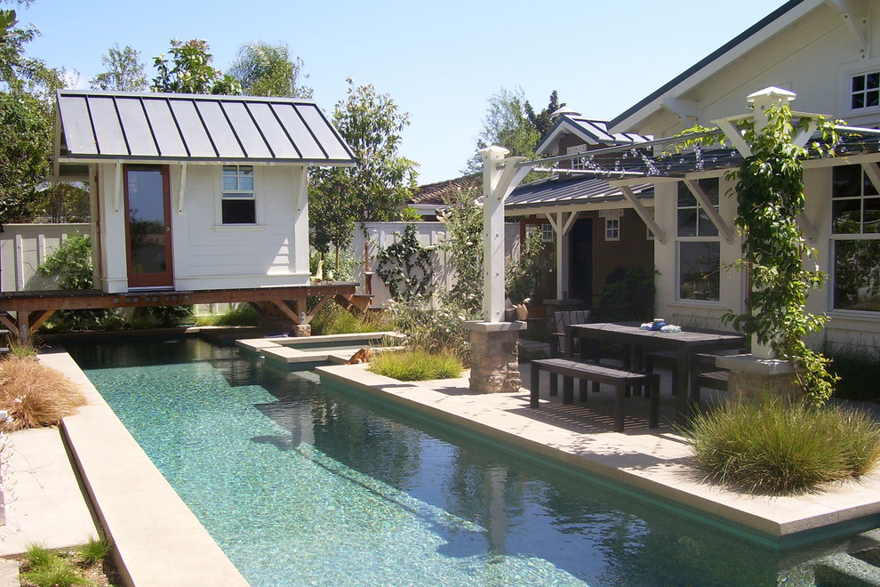 Mid-sized eclectic backyard full sun garden in Orange County with concrete pavers for summer.