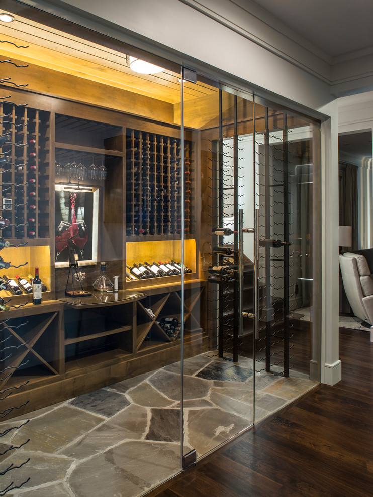 Inspiration for a large transitional wine cellar in Other with storage racks and multi-coloured floor.