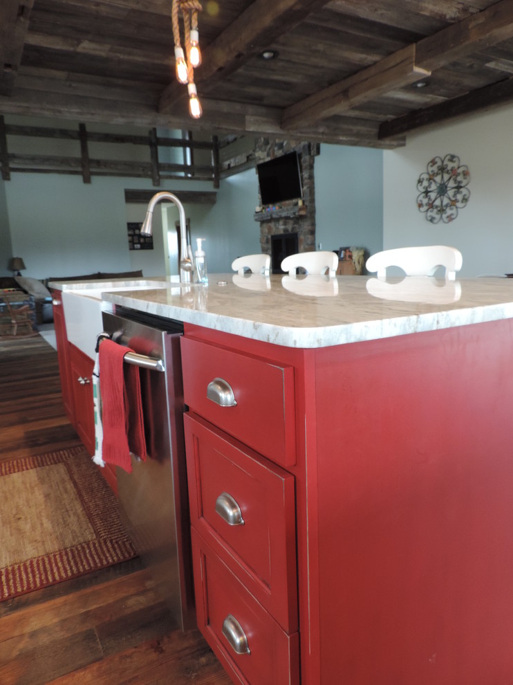 Example of a large mountain style u-shaped dark wood floor eat-in kitchen design with a farmhouse sink, raised-panel cabinets, white cabinets, marble countertops, stainless steel appliances and an island