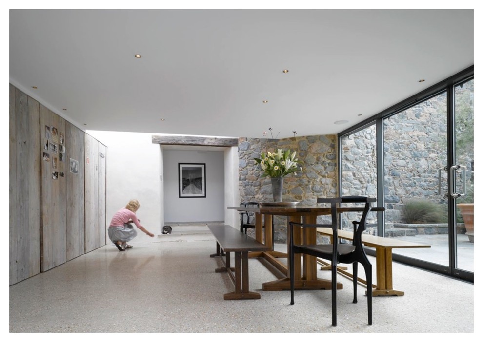This is an example of a contemporary dining room in Channel Islands.