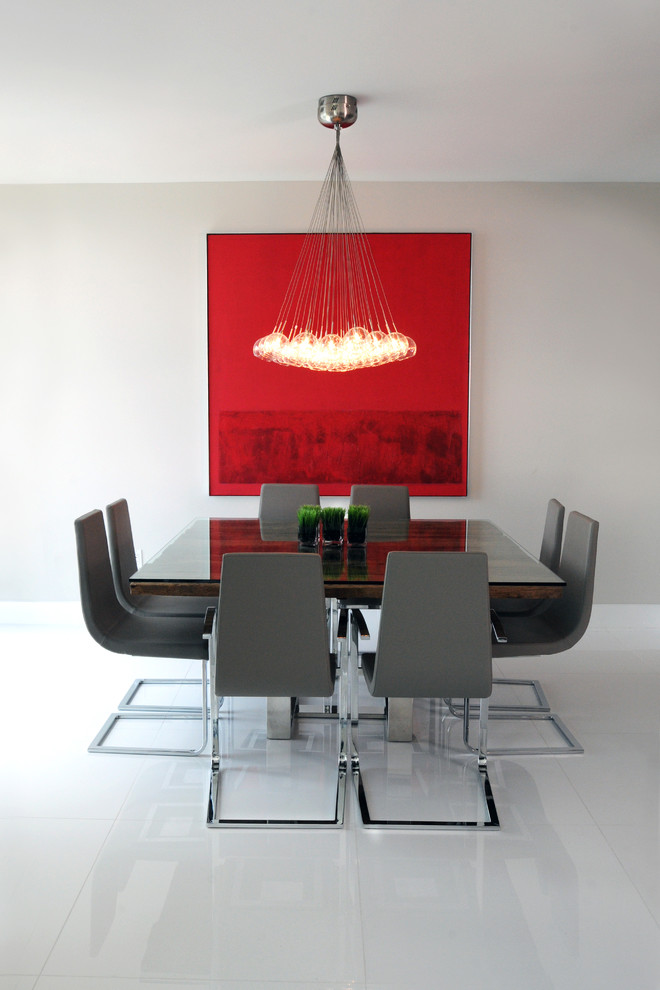 Contemporary dining room in Miami with white walls.