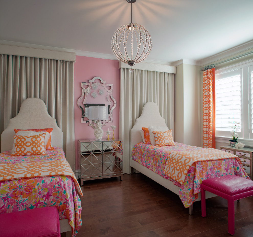 Design ideas for a transitional guest bedroom in Charleston with pink walls, medium hardwood floors and brown floor.