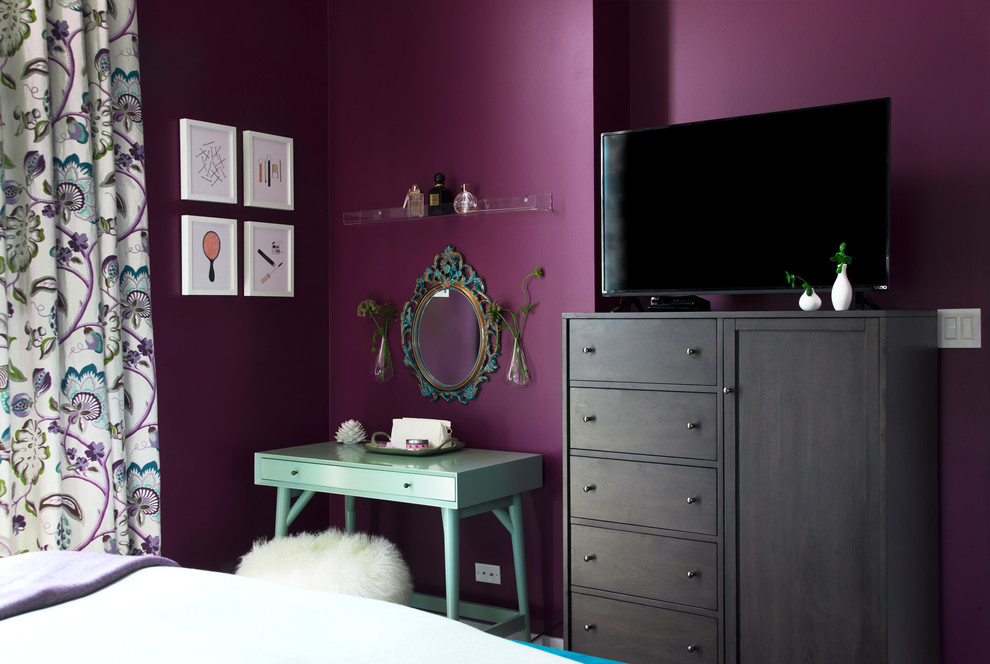 This is an example of a mid-sized transitional master bedroom in Chicago with purple walls and carpet.