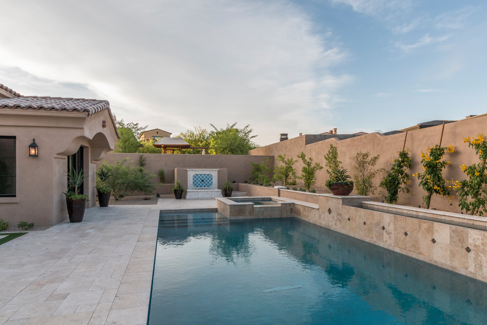 Huge transitional two-story stucco beige pool photo in Phoenix with a tile roof