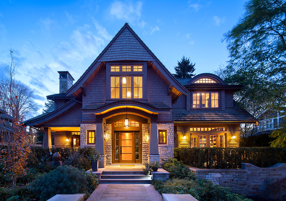 Inspiration for an arts and crafts two-storey exterior in Vancouver with wood siding.