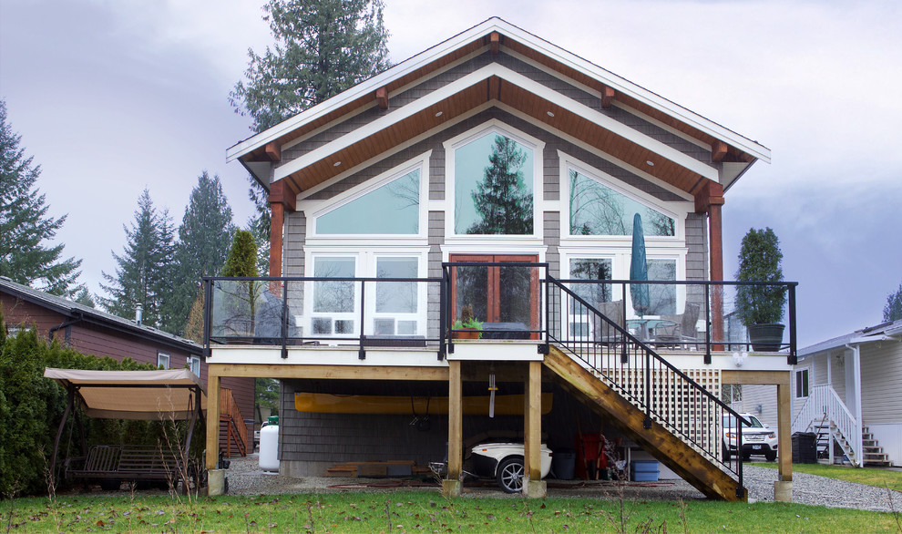 Inspiration for a large traditional backyard deck in Vancouver with an awning.