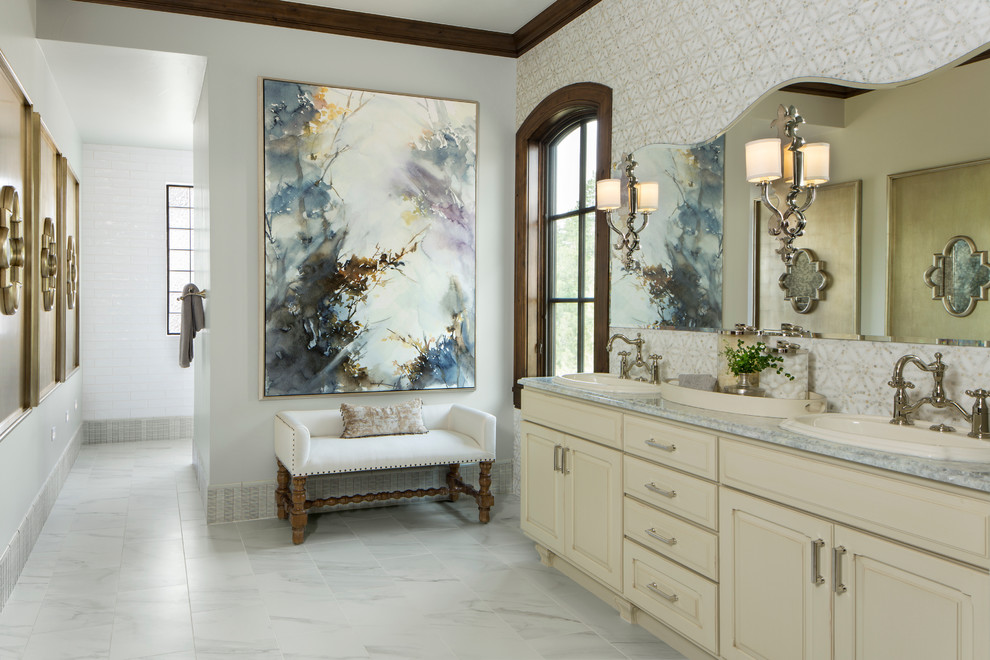 Inspiration for a large traditional master bathroom in Denver with raised-panel cabinets, yellow cabinets, grey walls, marble floors, a drop-in sink and marble benchtops.