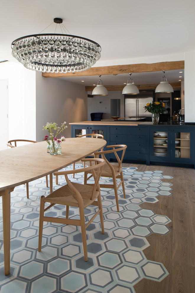 Photo of a contemporary dining room in Kent with blue floor.