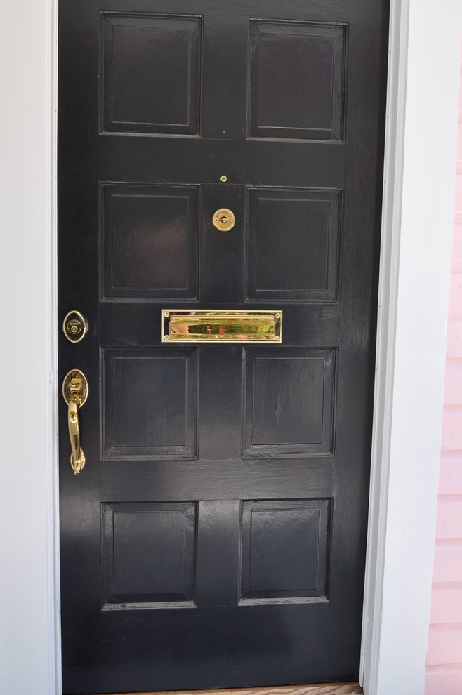 Traditional front door in Charleston with a single front door and a black front door.