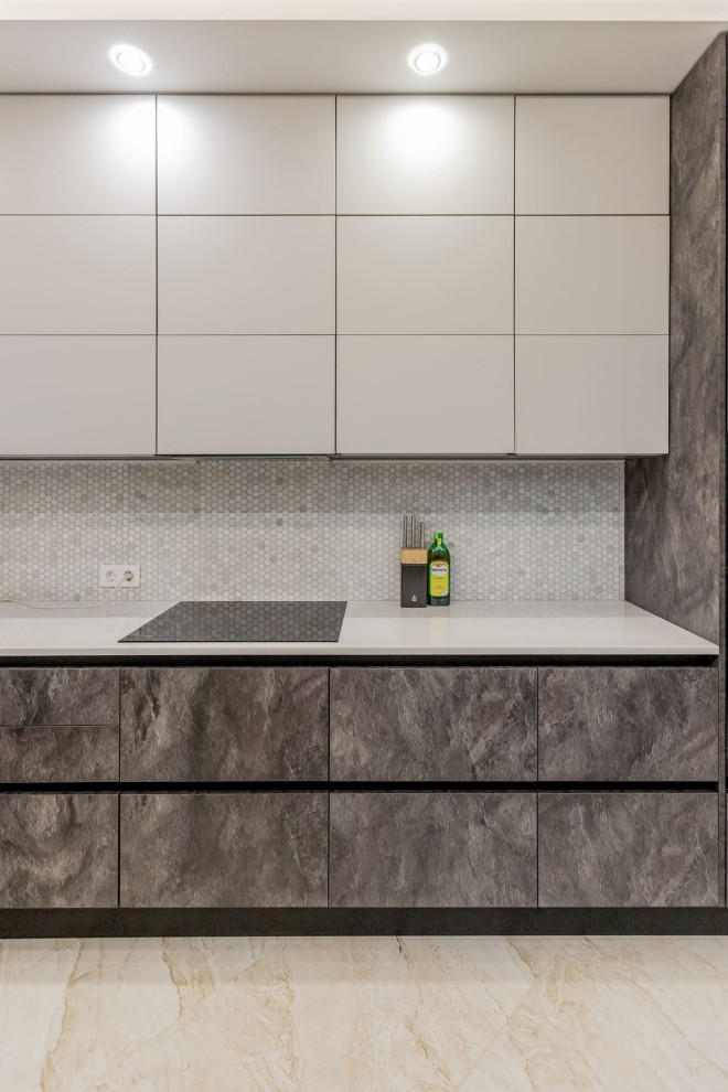Photo of a large contemporary l-shaped eat-in kitchen in Saint Petersburg with an undermount sink, raised-panel cabinets, grey cabinets, solid surface benchtops, grey splashback, mosaic tile splashback, white appliances, porcelain floors, no island, beige floor, grey benchtop and recessed.