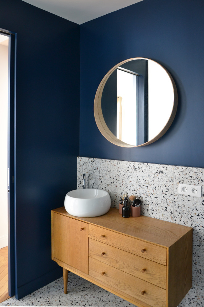 Photo of a mid-sized contemporary master bathroom in Paris with a curbless shower, a wall-mount toilet, multi-coloured tile, blue walls, a drop-in sink, wood benchtops, multi-coloured floor, an enclosed toilet and a single vanity.