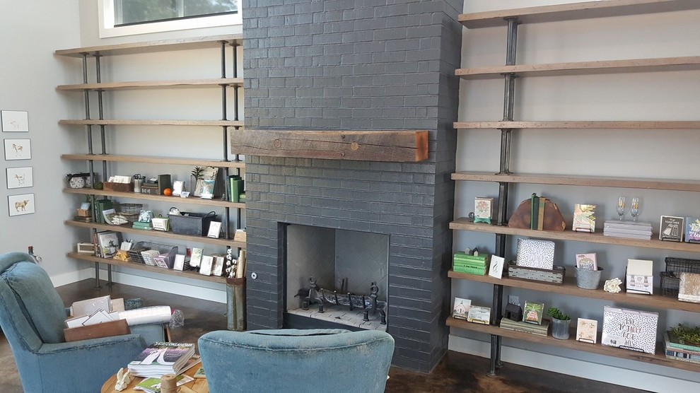 Inspiration for a mid-sized country enclosed living room in San Diego with white walls, concrete floors, a standard fireplace, a brick fireplace surround, no tv and brown floor.