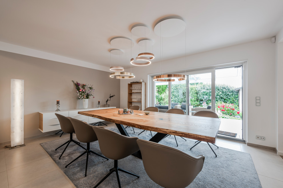 Example of a trendy gray floor dining room design in Frankfurt with white walls