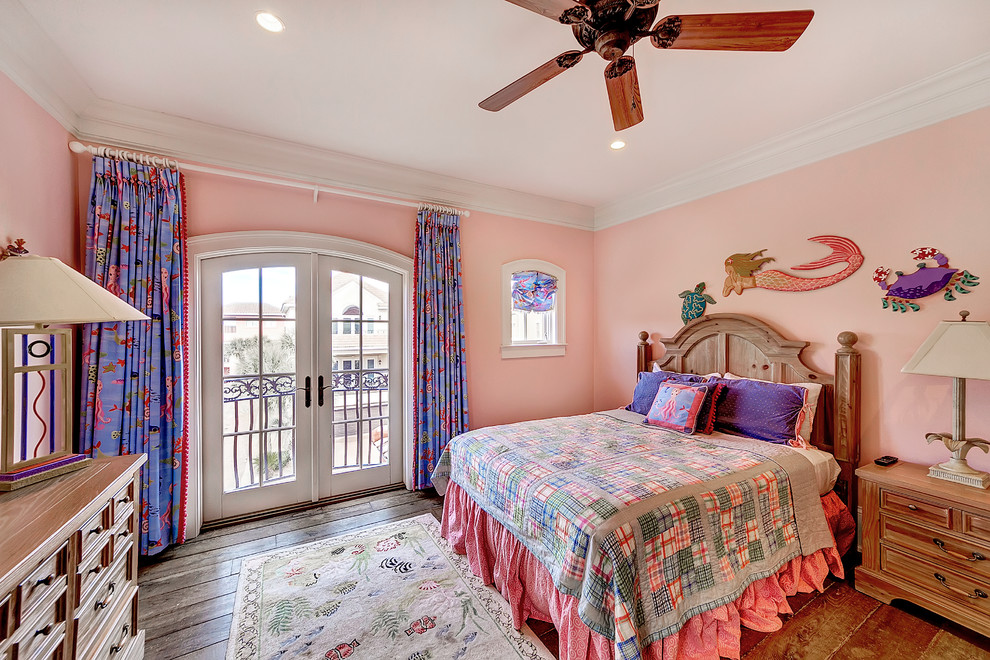 Design ideas for a beach style bedroom in Miami with pink walls and medium hardwood floors.