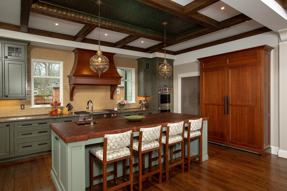 Inspiration for a large traditional kitchen in DC Metro with a single-bowl sink, green cabinets, quartz benchtops, beige splashback, stainless steel appliances, dark hardwood floors, with island, brown floor, shaker cabinets, subway tile splashback and grey benchtop.
