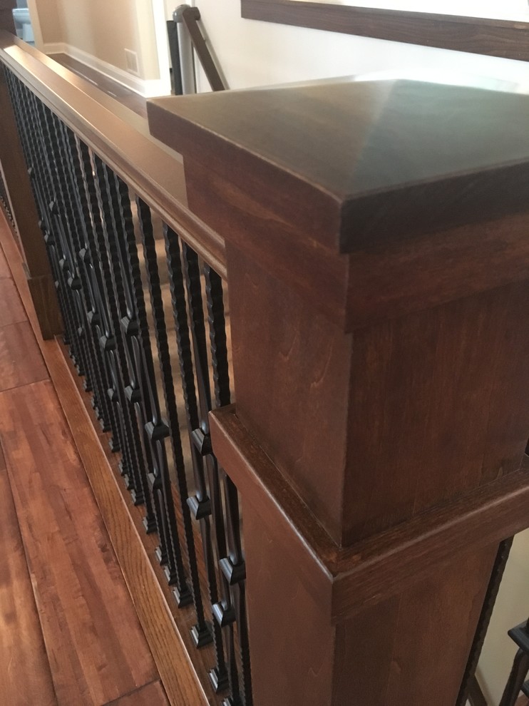 Inspiration for a medium sized traditional carpeted l-shaped metal railing staircase in Minneapolis with carpeted risers.