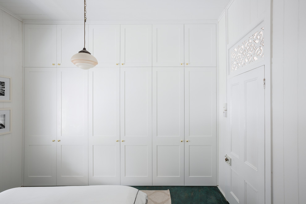 Mid-sized traditional gender-neutral built-in wardrobe in Brisbane with shaker cabinets.
