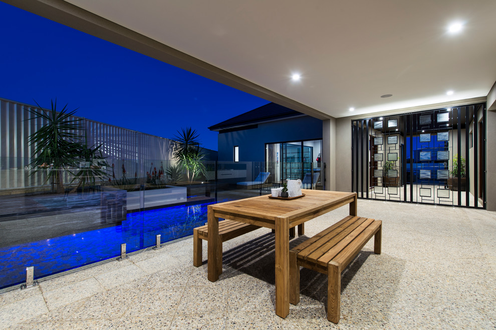 Design ideas for a contemporary patio in Perth with a roof extension.